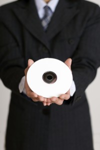 businessman holding a cd