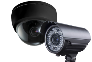 a bullet style surveillance camera with a black dome style surveillance camera