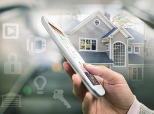 A homeowner using Alarm.com to control smart home devices.