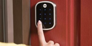 A Yale smart deadbolt is operated by a user.