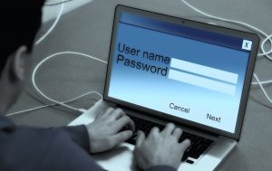 A computer user entering a username and password