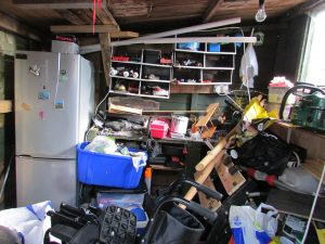 A basement cluttered with trash.
