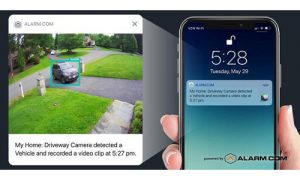 An Alarm.com camera clip showing a car driving into a driveway