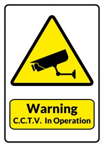 A sign reading "Warning, CCTV in Operation"