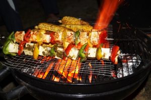A grill with meat and vegetables